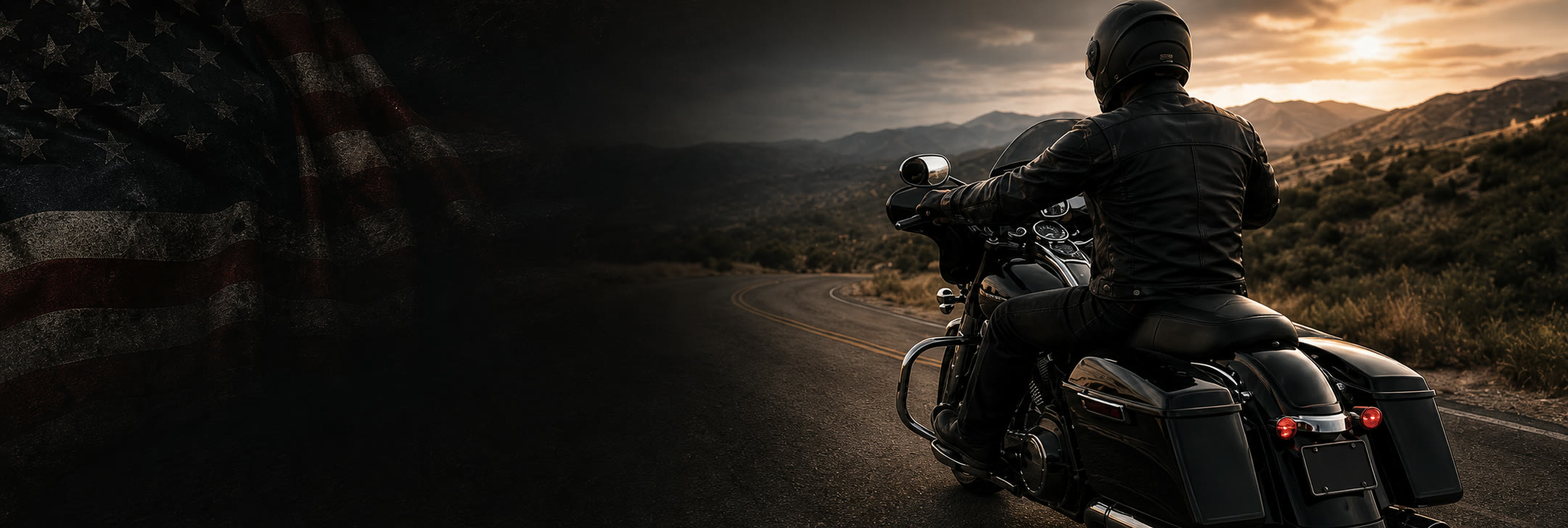 Veteran motorcyclist riding a black touring motorcycle on a mountain road